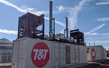 a containerized CHP generator installed outside a greenhouse