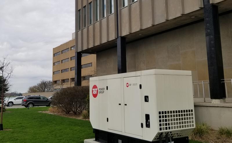 an enclosed diesel generator outside a municipal building